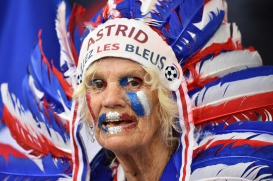 A France supporter has written "Astrid" on her Indian head ornament as she cheers prior to the Euro 2016 group A football match between France and Albania at the Velodrome stadium in Marseille on June 15, 2016. / AFP PHOTO / BERTRAND LANGLOIS