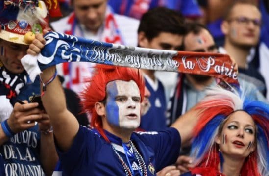 France supporters cheer prior to the Euro 2016 group A football match between France and Albania at the Velodrome stadium in Marseille on June 15, 2016. / AFP PHOTO / BERTRAND LANGLOIS