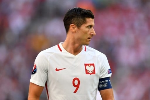 Poland's forward Robert Lewandowski reacts during the Euro 2016 group C football match between Ukraine and Poland at the Velodrome stadium in Marseille on June 21, 2016. / AFP PHOTO / BERTRAND LANGLOIS