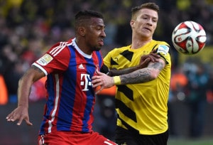 Kollegen in der Nationalmannschaft, erbitterte Konkurrenten um den Titel in der Bundesliga. Bayerns Jérôme Boateng (l.) und Marco Reus (r.) beim Duell 2015. AFP PHOTO / PATRIK STOLLARZ