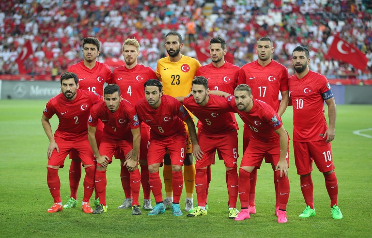 Turkey's national football team players pose prior to the Euro 2016 qualifying match between Turkey and The Netherlands at Konya's Arena on September 6, 2015 in Konya. (Front Row - From L) Defender Sener Ozbayrakli, midfielder  Oguzhan Ozyakup, midfielder Selcuk Inan, midfielder Hakan Calhanoglu and defender Caner Erkin, and (Back Row - From L) defender Ozan Tufan, defender Serdar Aziz, goalkeeper Volkan Babacan, defender Hakan Balta, forward Burak Yilmaz and midfielder Arda Turan. AFP PHOTO / STRINGER