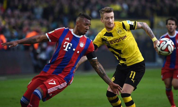 Bayerns Jerome Boateng und Dortmund's Marco Reus (R) beim Bundesligamatch Borussia Dortmund gegen FC Bayern München in Dortmund am 4.April 4 2015. AFP PHOTO / PATRIK STOLLARZ