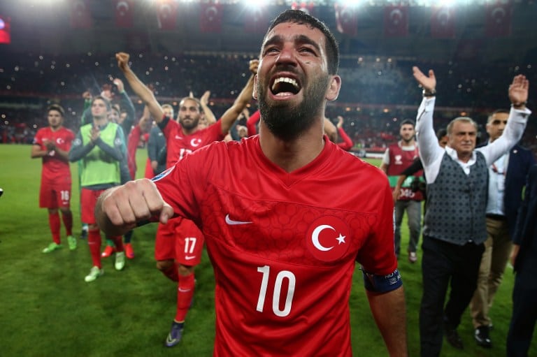 Turkey's midfielder Arda Turan (C) celebrates at the end of the Euro 2016 Group A qualifying football match between Turkey and Iceland on October 13, 2015 at the Konya Arena stadium in Konya. AFP PHOTO / STRINGER