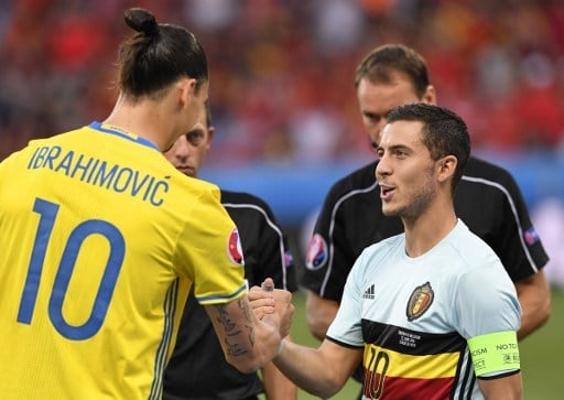 Sweden's forward Zlatan Ibrahimovic (L) shakes hands with Belgium's forward Eden Hazard before the Euro 2016 group E football match between Sweden and Belgium at the Allianz Riviera stadium in Nice on June 22, 2016. / AFP PHOTO / JONATHAN NACKSTRAND