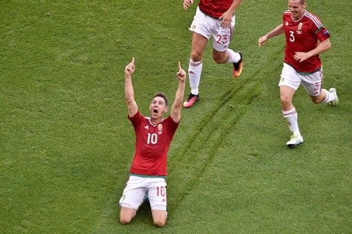 Hungary's midfielder Zoltan Gera (C) celebrates after scoring a goal during the Euro 2016 group F football match between Hungary and Portugal at the Parc Olympique Lyonnais stadium in Decines-Charpieu, near Lyon, on June 22, 2016. / AFP PHOTO / JEAN-PHILIPPE KSIAZEK