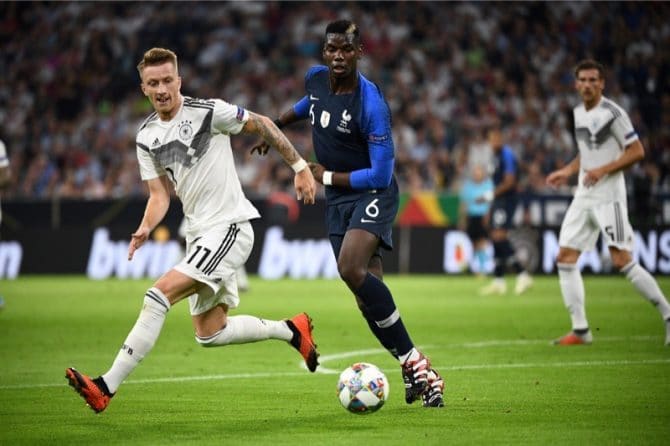 Deutschlands Marco Reus (L) und Frankreichs Paul Pogba (R) im Zweikampf beim UEFA Nations League Spiel der beiden Nationen am 6. September 2018 in der Münchner Allianz Arena. / AFP PHOTO / FRANCK FIFE