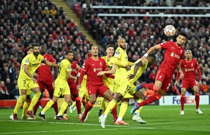Liverpool's Colombian midfielder Luis Diaz (R) heads the ball during the UEFA Champions League semi-final first leg match between Liverpool and Villarreal at Liverpool's Anfield stadium on April 27, 2022. (Photo by Oli SCARFF / AFP)