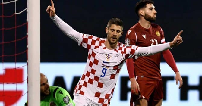 Croatia's forward #09 Andrej Kramaric (C) celebrates after Croatia opened the scoring during the UEFA Euro 2024 Group D qualification football match between Croatia and Armenia at the Maksimir Stadium in Zagreb, on November 21, 2023. (Photo by DENIS LOVROVIC / AFP)