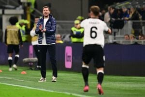 Der deutsche Cheftrainer Julian Nagelsmann reagiert während des Viertelfinal-Hinspiels der Nations League zwischen Italien und Deutschland im San-Siro-Stadion in Mailand am 20. März 2025. (Foto: Marco BERTORELLO / AFP)