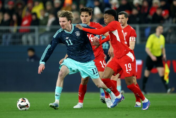 Nick Woltemade (#11) setzt sich gegen Alvyn Sanches (#19) von der Schweiz durch beim Länderspiel im St. Jakob-Park in Basel am 27. März 2026. Alexander Hassenstein / Getty Images