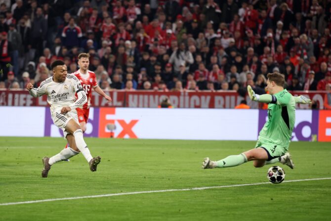 Kylian Mbappé überwindet FC-Bayern-Torwart Manuel Neuer zum 3:0 für Real Madrid im UEFA Champions League Viertelfinale-Rückspiel am 15. April 2026 in München. Der Franzose schoss unhaltbar ein. Alex Grimm / Getty Images